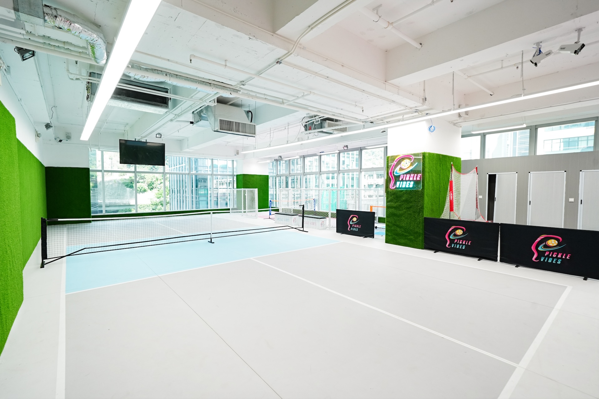 Competition court with turf-wrapped walls and window light