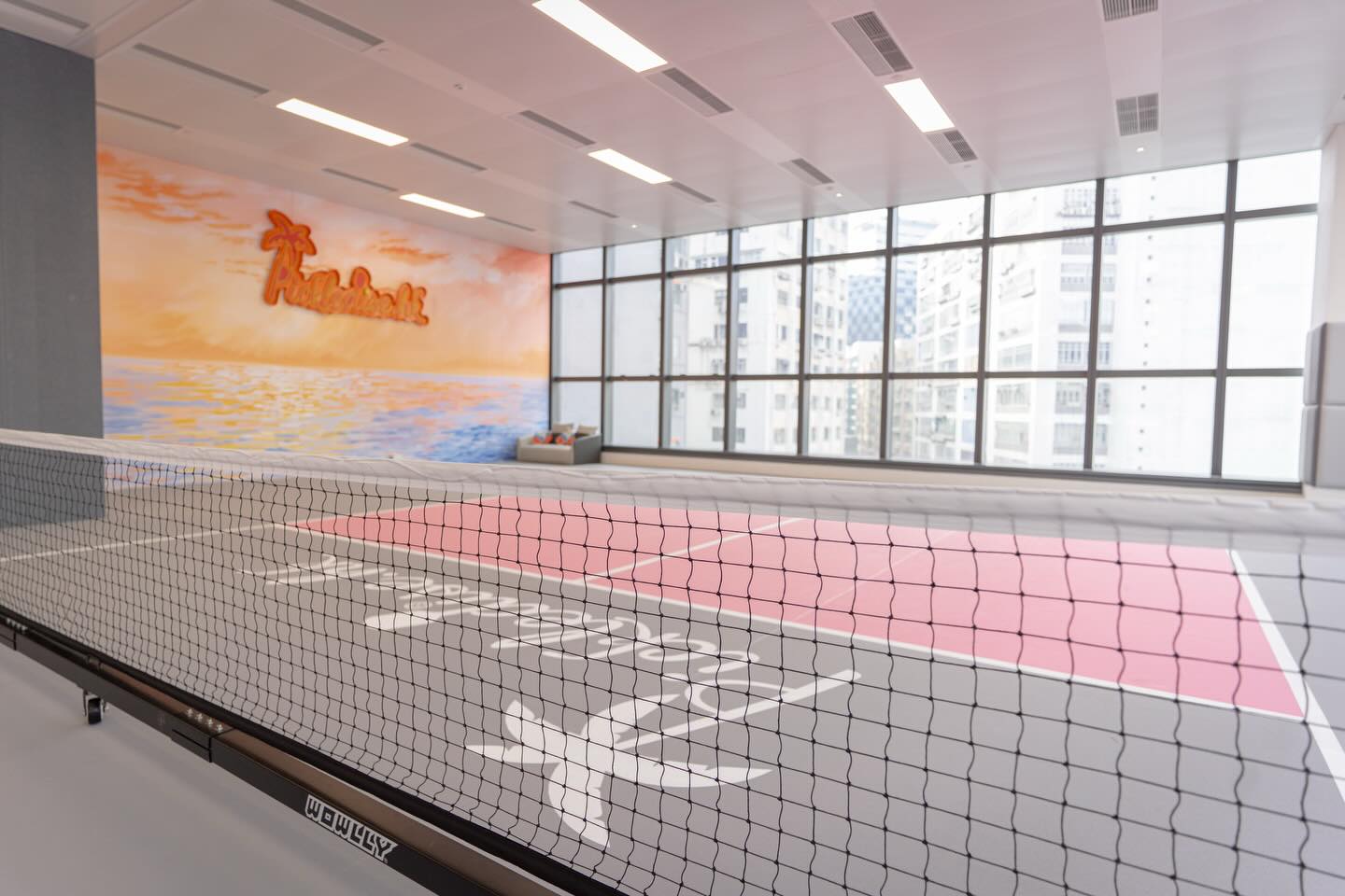 Signature sunset-palm mural and city views