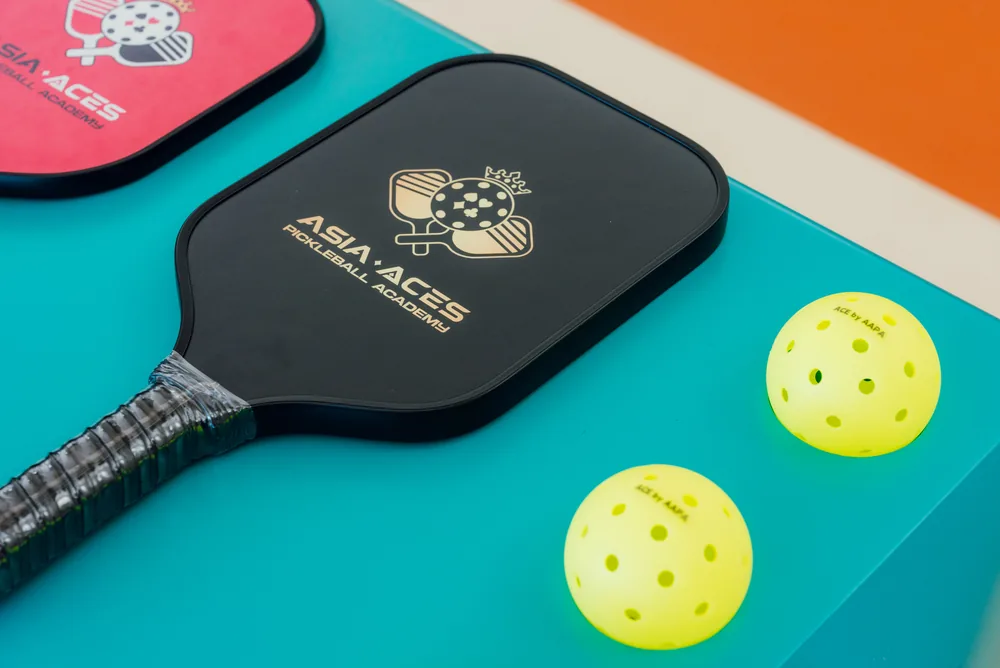 Asia Aces branded paddles and balls